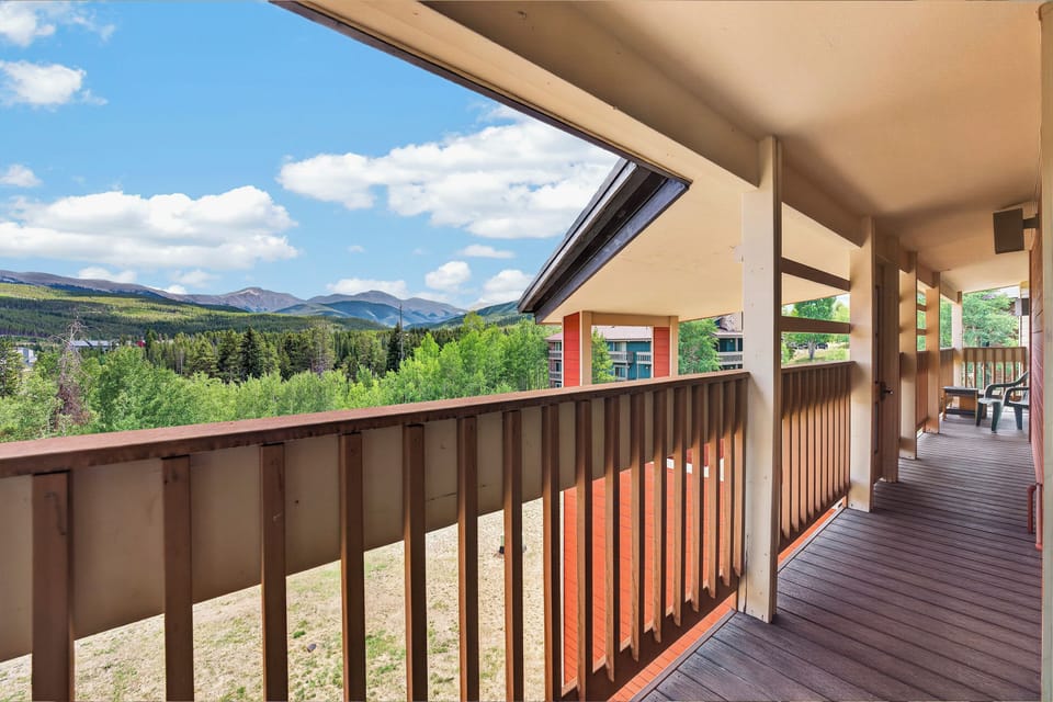 Breathe in the fresh mountain air from your private balcony, where sweeping forest views and dramatic peaks create a stunning backdrop for morning coffee or evening relaxation.