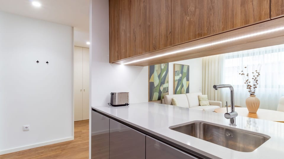 Discover the inviting charm of the living space, where stylish decorative accents and soft furnishings create a welcoming atmosphere for you to relax and feel at home. #InteriorDetails #CozyNook #ModernDecor #AccentPieces #HomeAwayFromHome