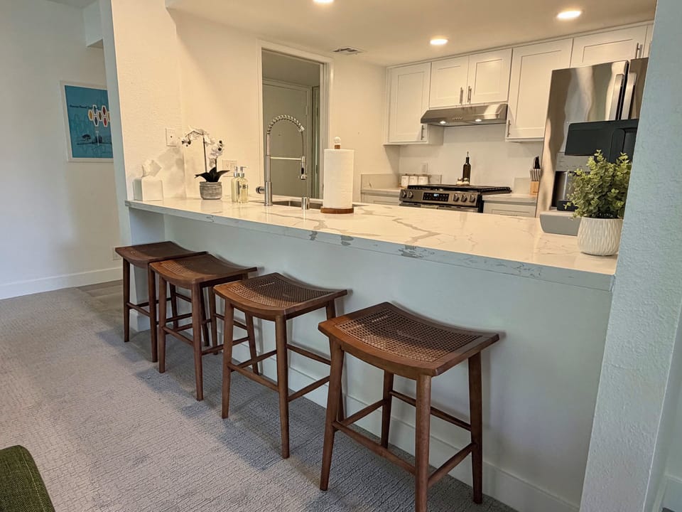 Modern kitchen with breakfast bar seating for casual meals
