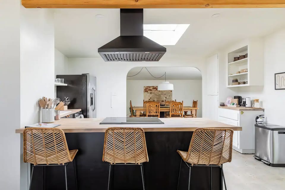 The island and hood, with the arch through to the dining room.