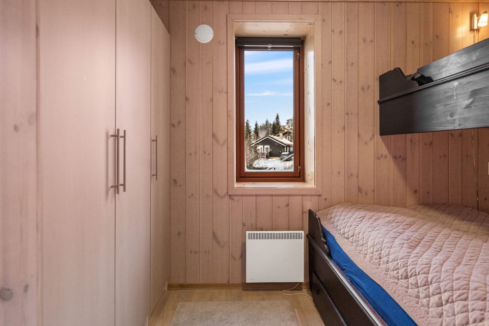 Bedroom with a bunked bed, double at the bottom and single on top