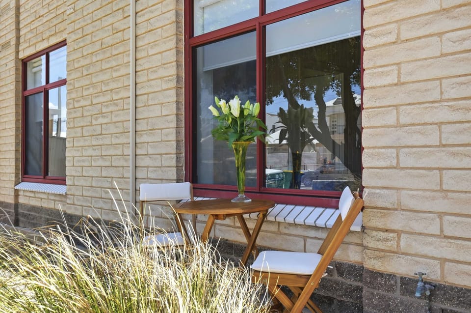 outdoor chairs and table kept folded inside. Can be brought out for guest use as needed.