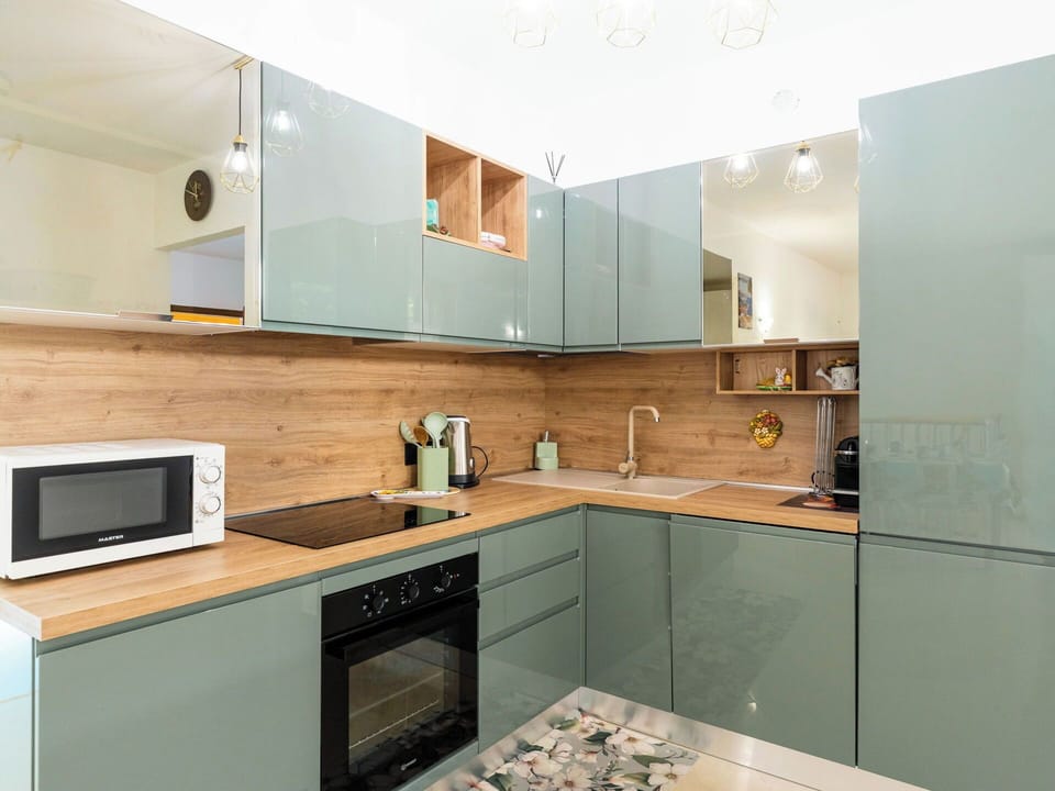 Kitchen, Kitchen Appliance, Countertop, Cabinetry, Major Appliance, Furniture, Interior Design, Wood, Flooring, Kitchen Stove