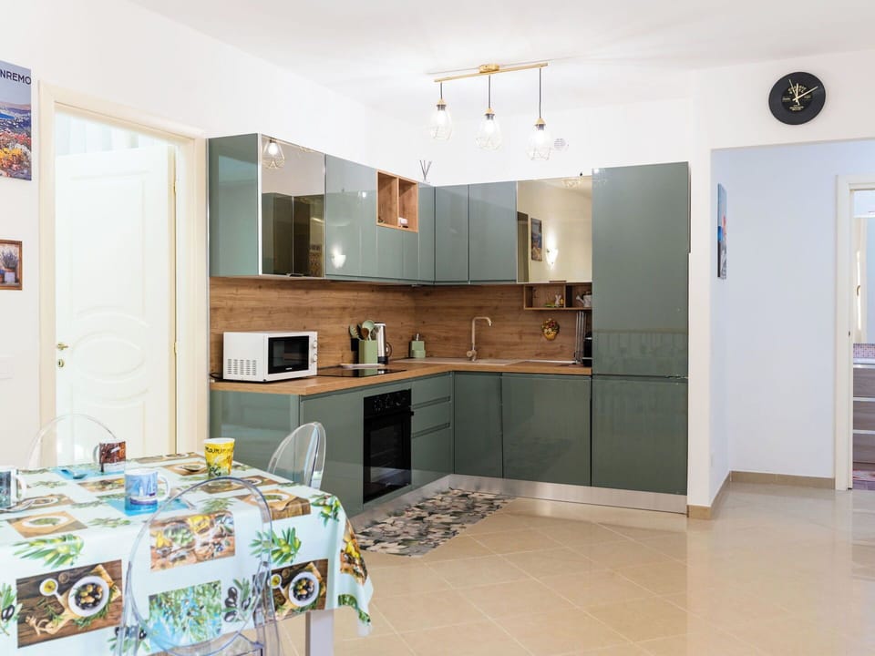 Furniture, Kitchen, Cabinetry, Countertop, Interior Design, Kitchen Appliance, Flooring, Major Appliance, Wood, Floor