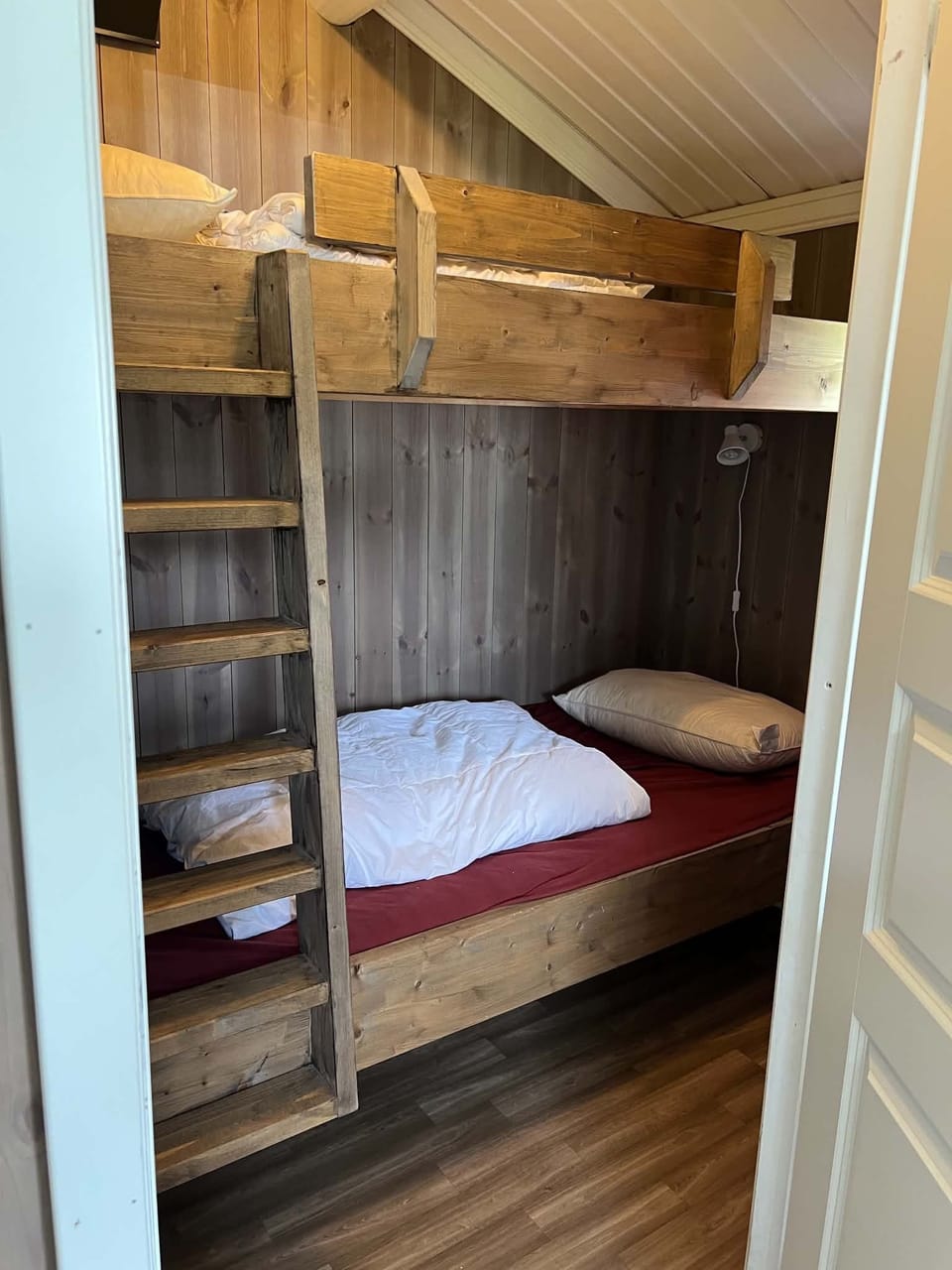 Compact and cozy bedroom with bunk bed, perfect in a mountain getaway.