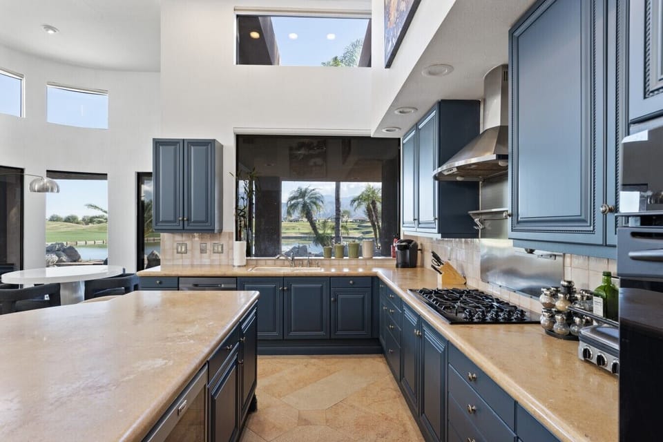 Gourmet kitchen with large island and scenic views