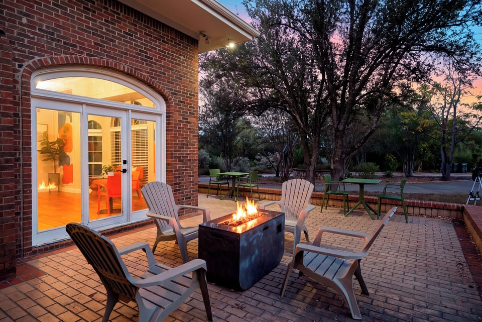 Backyard fire pit with Adirondack seating.