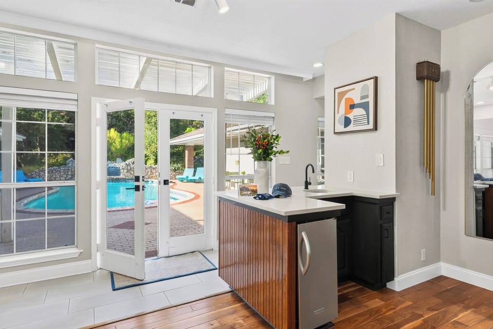 Kitchen island with direct access to the pool patio.