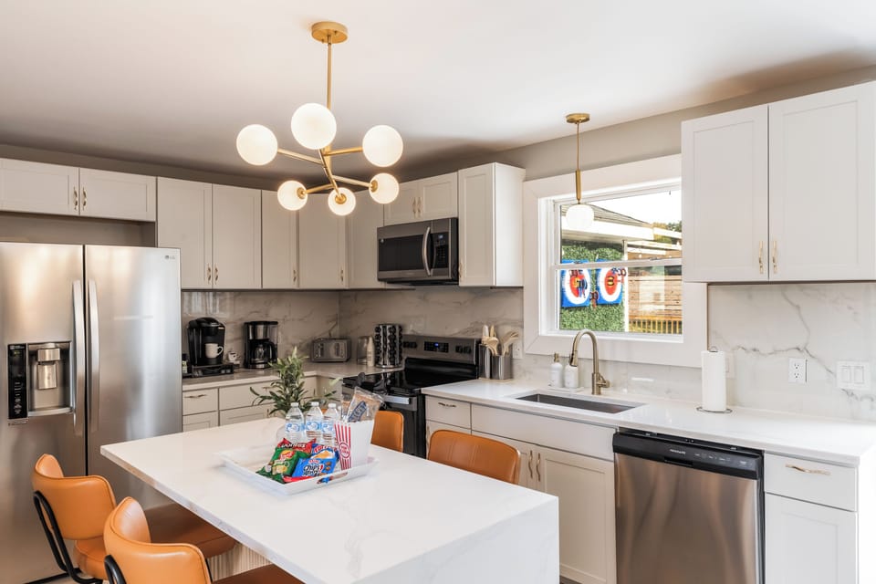 Pet-friendly touches with dog bed, bowls, blanket, and toys ready to enjoy