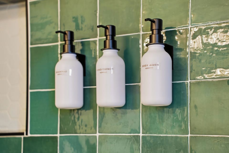 Bathrooms stocked with shampoo, conditioner, and body wash