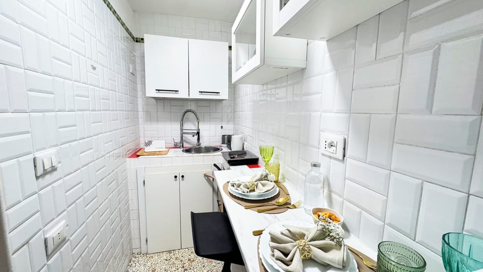 Apartment (1 Bedroom) | Private kitchen | Microwave, stovetop, highchair, cookware/dishes/utensils