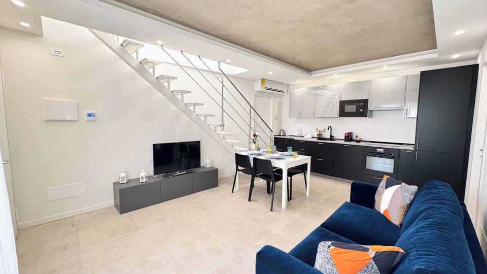Apartment (2 Bedrooms) | Living area | 32-inch Smart TV with cable channels
