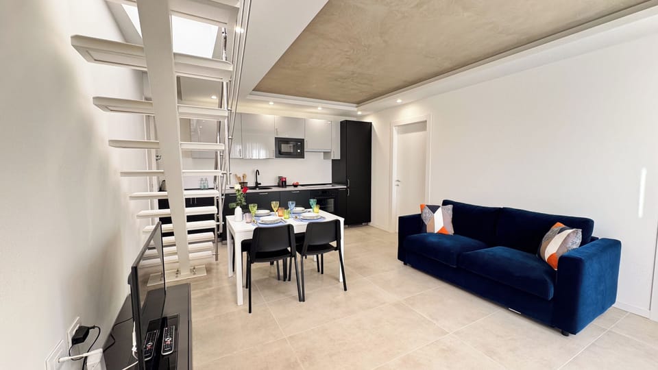 Apartment (2 Bedrooms) | Living area | 32-inch Smart TV with cable channels