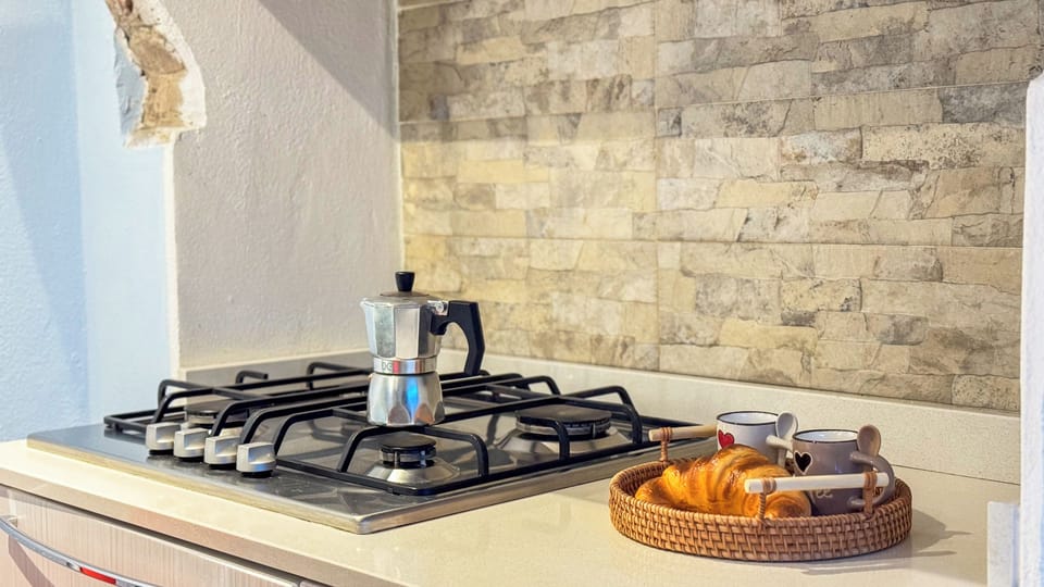 Apartment (1 Bedroom) | Private kitchen | Espresso maker, microwave, stovetop, dishwasher