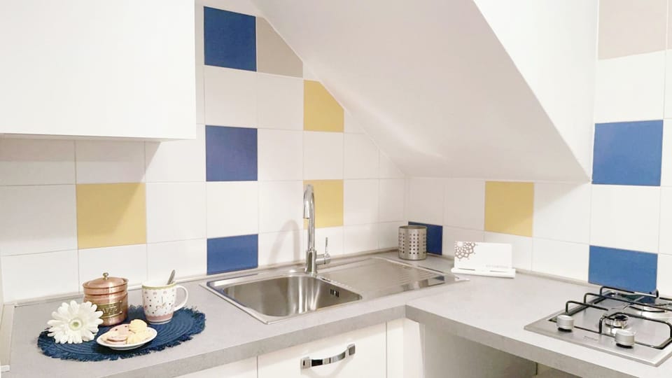 Apartment (1 Bedroom) | Private kitchen | Microwave, stovetop, electric kettle, highchair