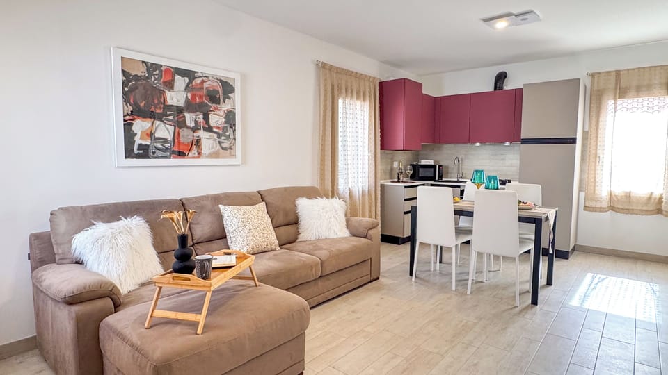 Apartment (1 Bedroom) | Living area | 32-inch TV with cable channels