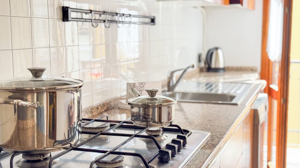 Apartment (2 Bedrooms) | Private kitchen | Oven, stovetop, electric kettle, highchair