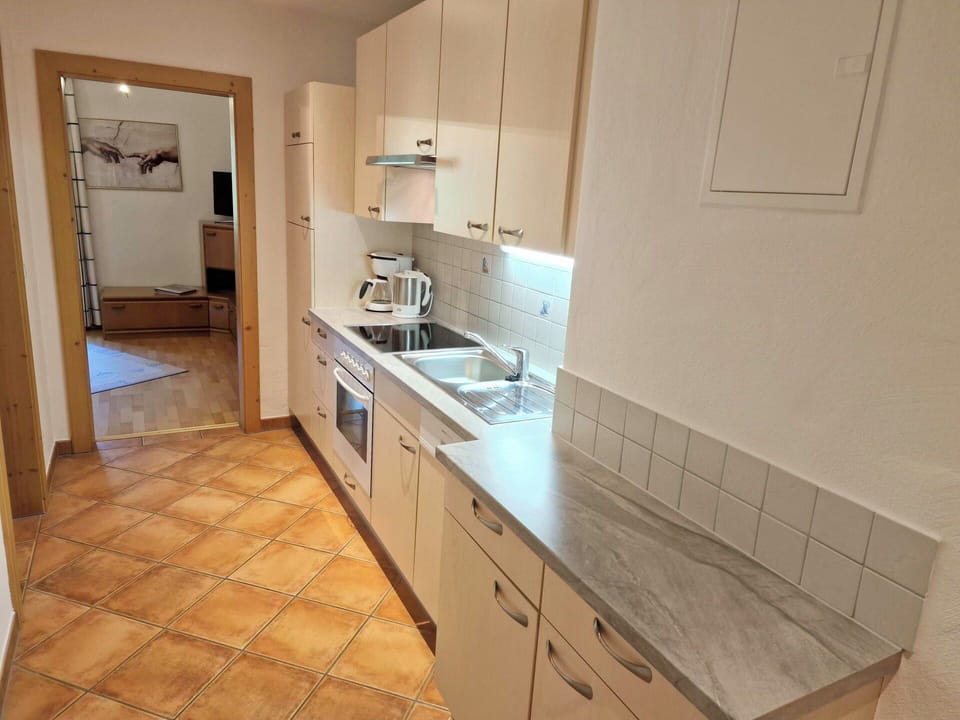 Countertop, Kitchen, Flooring, Floor, Cabinetry, Kitchen Appliance, Wood, Kitchen Sink, Furniture, Interior Design
