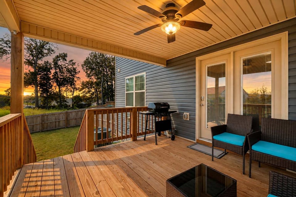 Porch: A welcoming backyard deck with comfortable seating and a BBQ grill, offering a relaxed outdoor space for grilling, dining, and spending time together.
