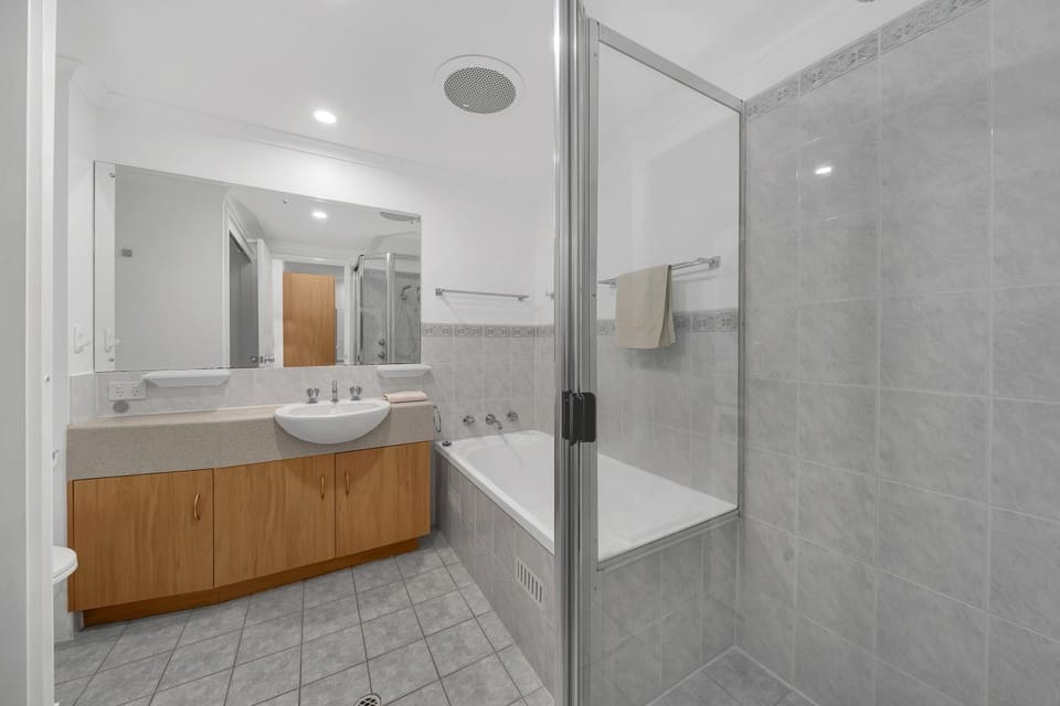 Spa-style bathroom with soaking tub and glass shower