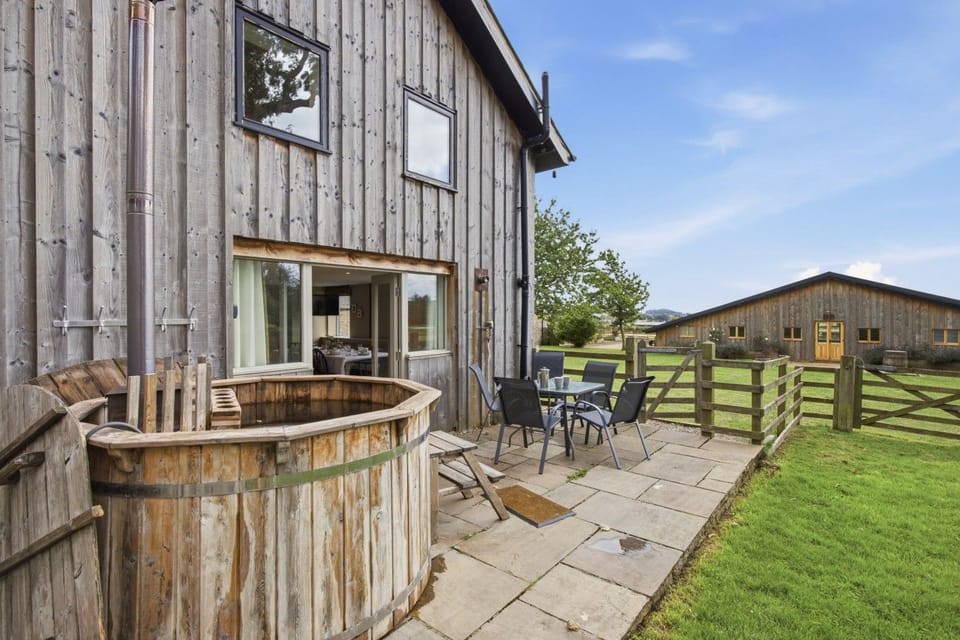 Drum Barn patio with wood-fired Scandi hot tub and outdoor seating