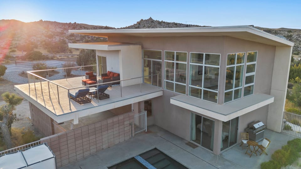 Step onto the upper balcony for fresh desert air, golden-hour sunshine, and sweeping views across the surrounding landscape.