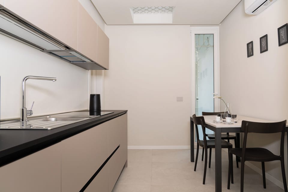 Apartment (1 Bedroom) | Private kitchen | Stovetop, electric kettle, cookware/dishes/utensils, dining table