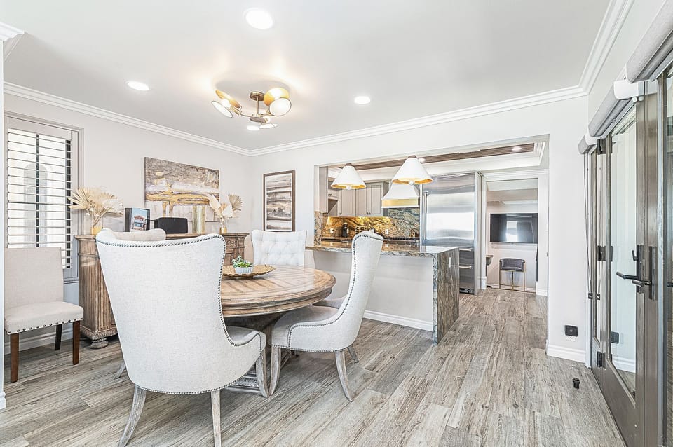 Gather around the dining table for meals just steps from the kitchen
                