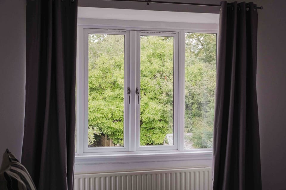 Enjoy a restful night's sleep in this inviting double bedroom with soft bedding and bedside lighting.