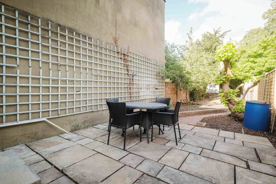 Enjoy some fresh air in the private courtyard, complete with outdoor seating for a relaxing break.