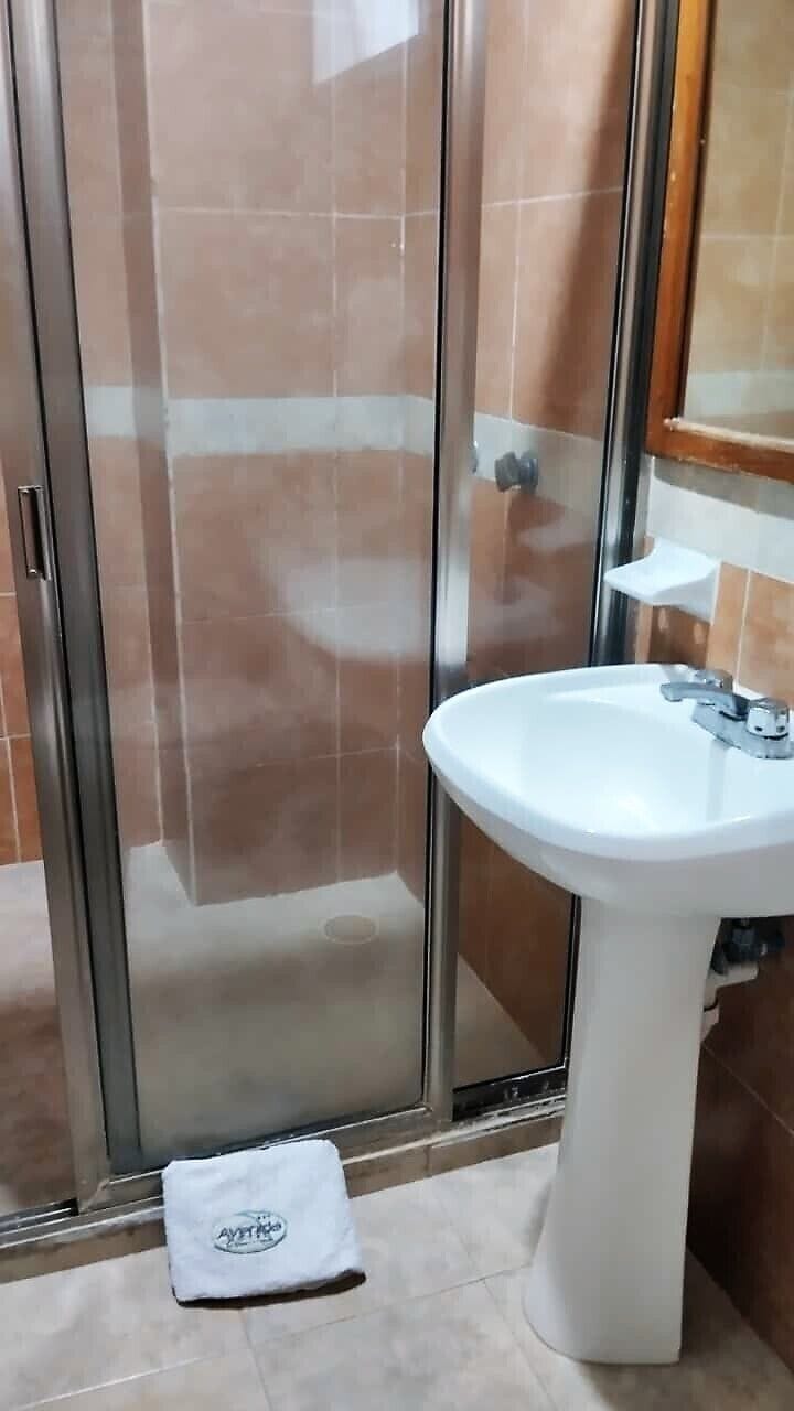 Basic Double Room, 2 Double Beds | Bathroom | Shower, towels, soap, shampoo