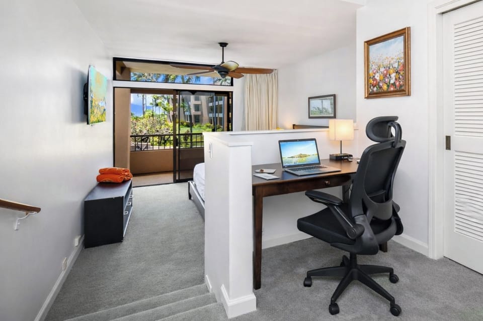 A dedicated desk and chair in your primary suite make remote work simple, keeping productivity close to your personal space. KRO-G201