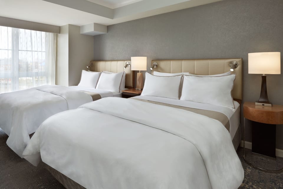 Family Suite, 2 Bedrooms | Premium bedding, down comforters, pillowtop beds, in-room safe