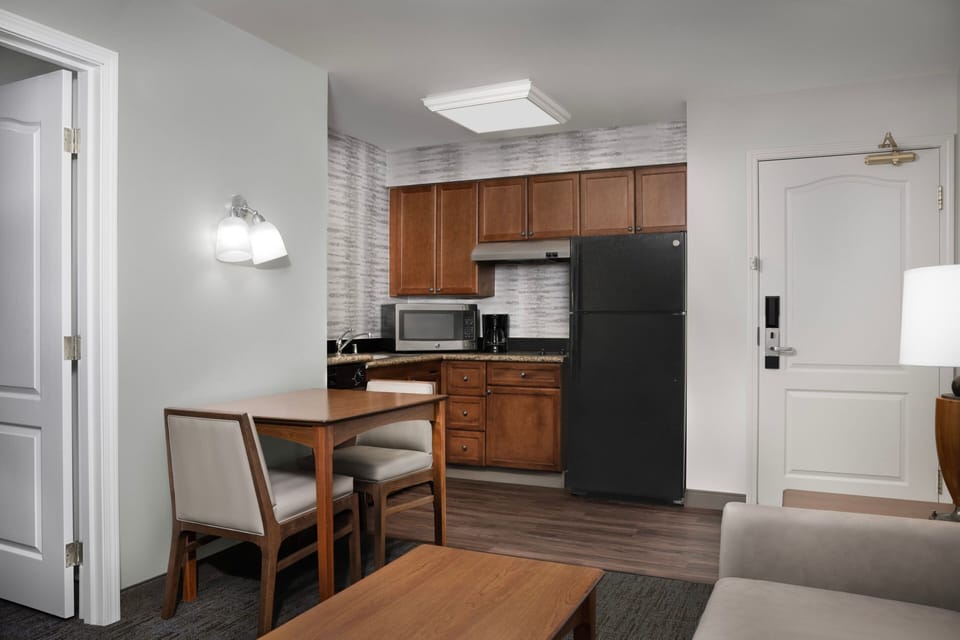Suite, 1 Bedroom | Private kitchen | Full-size fridge, microwave, stovetop, dishwasher