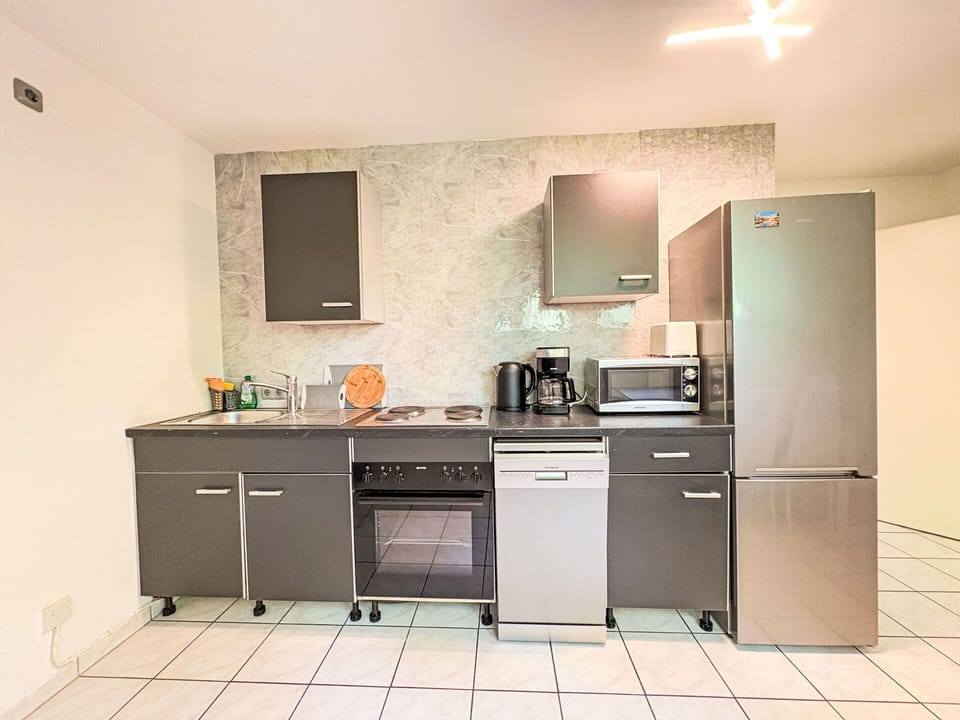 Kitchen, Kitchen Appliance, Major Appliance, Countertop, Cabinetry, Furniture, Flooring, Home Appliance, Interior Design, Kitchen Stove