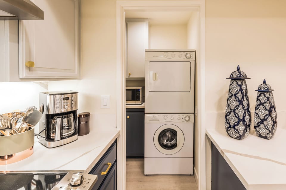 In-unit laundry conveniently located beside the kitchen