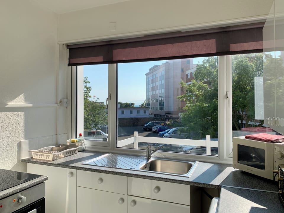Suite, Balcony | Private kitchen | Coffee/tea maker, fridge, microwave, stovetop