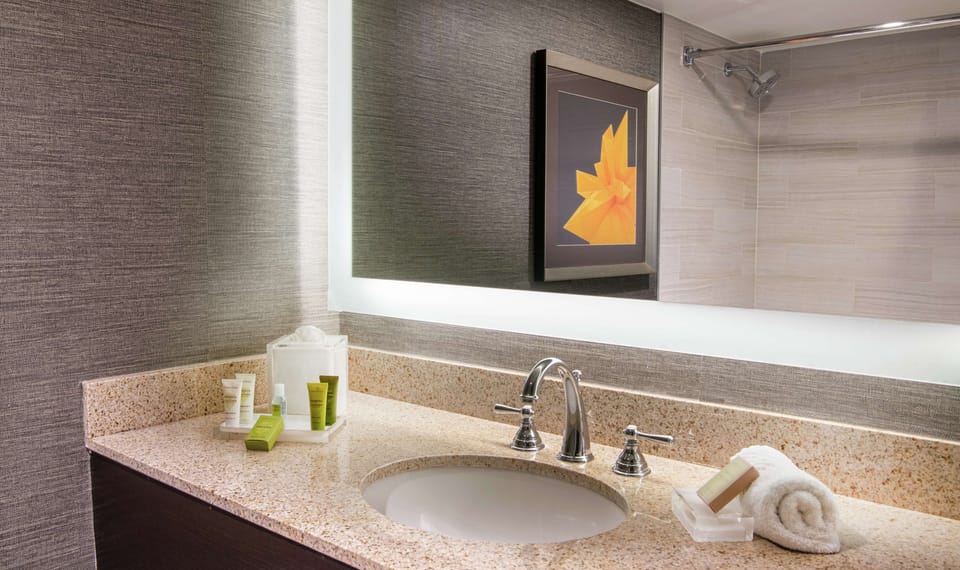 Combined shower/tub, designer toiletries, hair dryer, towels
