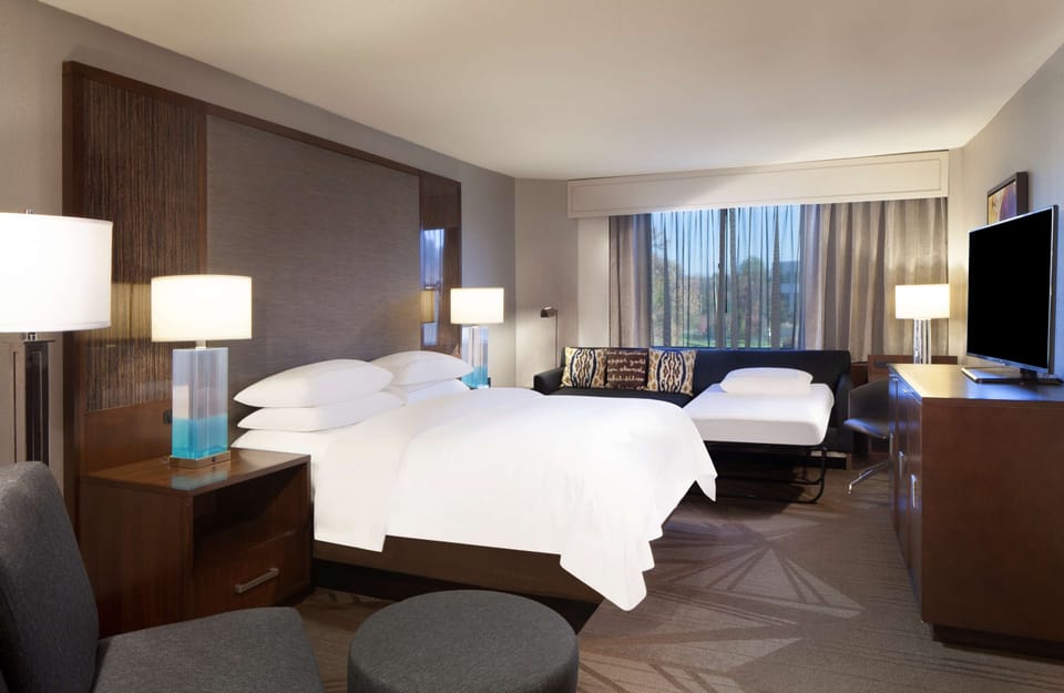 Premium bedding, down comforters, pillowtop beds, in-room safe