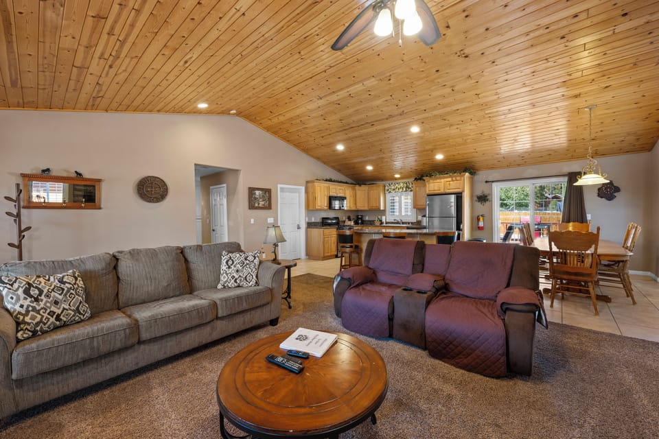 Living Room - Living Room with comfy seating, smart TV, and vaulted ceilings.