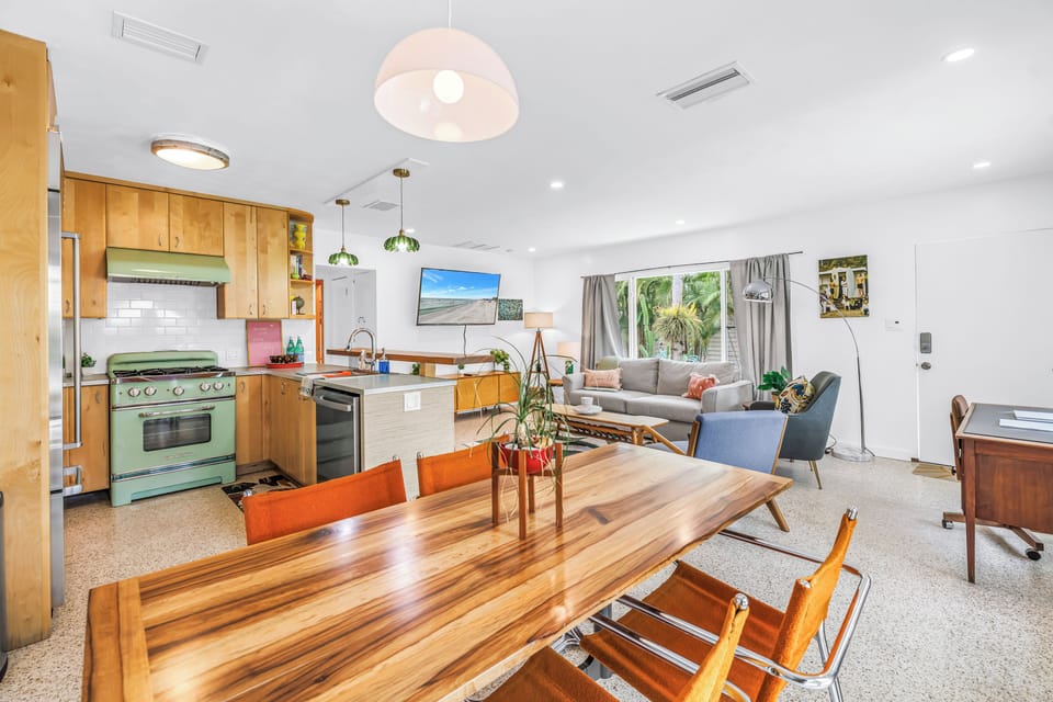 Bright open-concept home with retro kitchen and spacious dining area