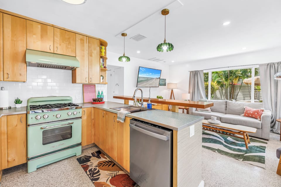 Bright open kitchen with retro charm and sunny tropical living space