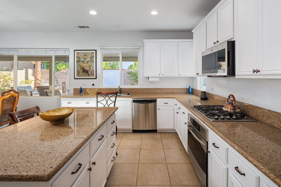 Kitchen with gas cooktop and wall oven