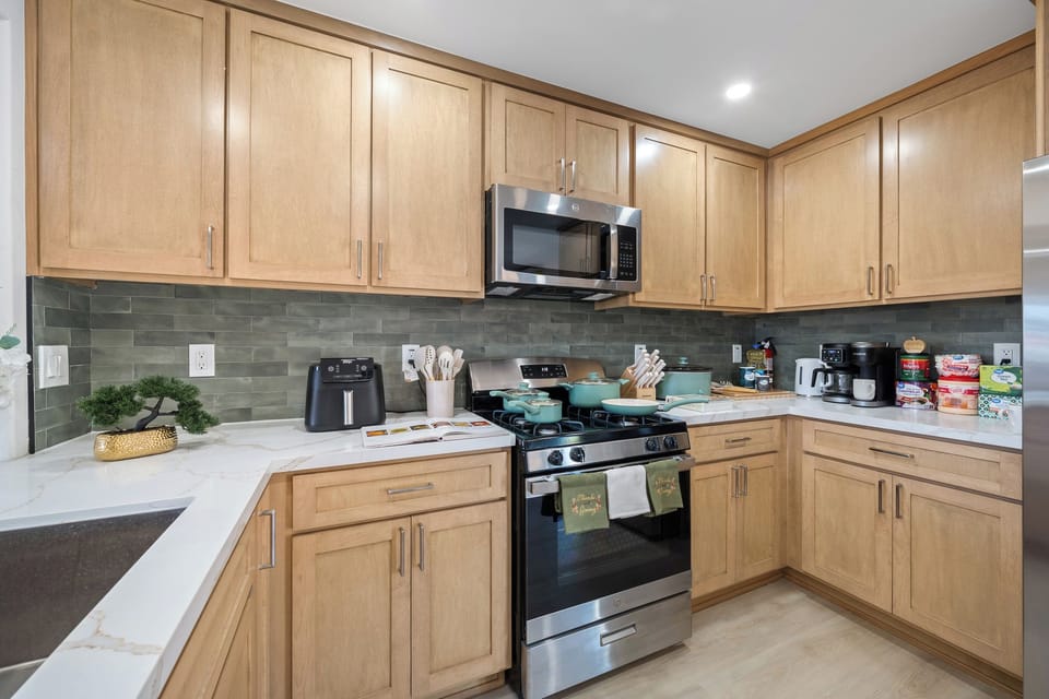Kitchen counter stocked with everyday cooking items and appliances