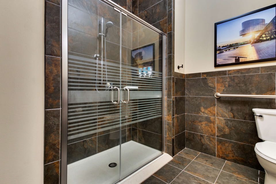 Suite, 1 King Bed with Sofa bed, Hearing Accessible (Sofa Sleeper, Roll-in Shower, 2 Rooms) | Bathroom | Combined shower/tub, free toiletries, hair dryer, towels