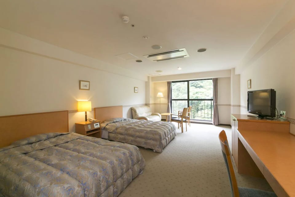 Twin Room, Half board, Non Smoking | Premium bedding, in-room safe, desk, iron/ironing board