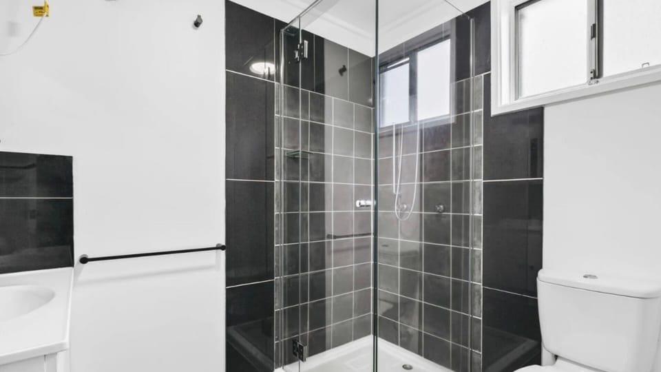 Sleek bathroom with a walk-in shower