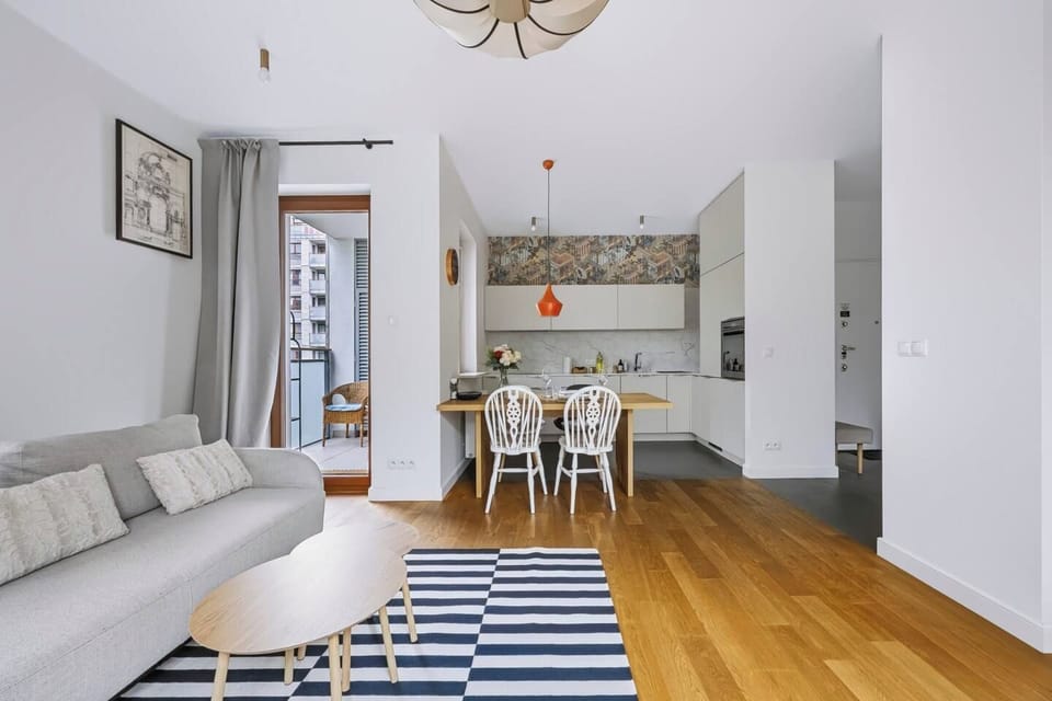 Living room with a sofa and Smart TV | Book now with Rentujemy