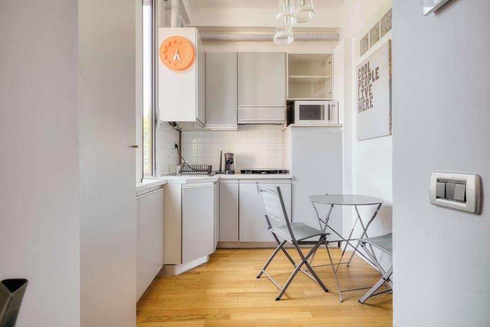 Bright kitchen and dining space with modern appliances and a practical layout.