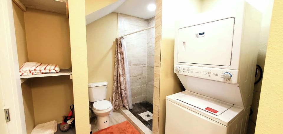 Full bath 1 with washer and dryer.